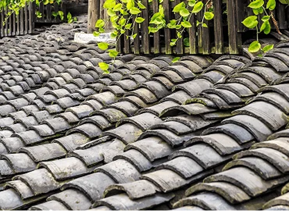 Slate or specialty roof repair with damaged sections addressed and sealed
